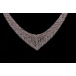 Tiffany & Co. - A silver mesh bib necklace with tie ends, designed by Elsa Peretti, signed by T&