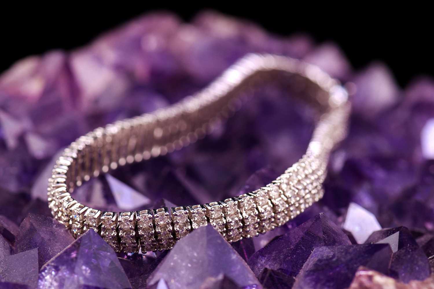 A three-row diamond tennis bracelet, featuring arrays of brilliant diamond with an estimated total - Image 9 of 9