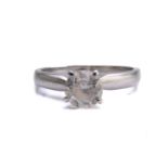 A diamond solitaire ring in platinum, centring with a brilliant-cut diamond approximately measures