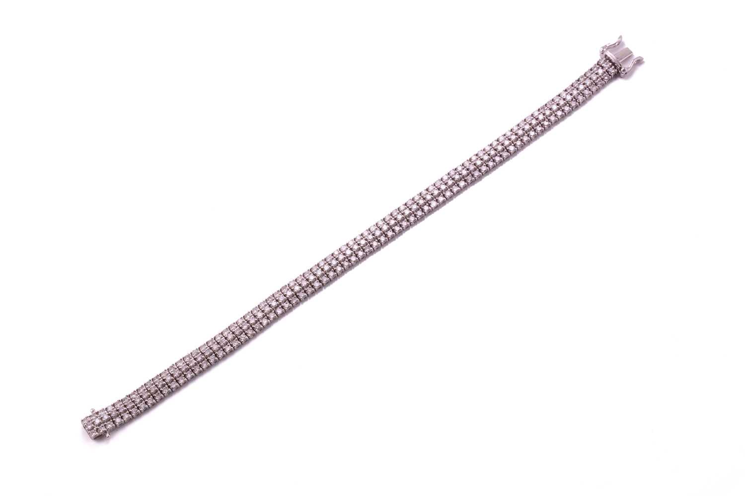 A three-row diamond tennis bracelet, featuring arrays of brilliant diamond with an estimated total - Image 2 of 9