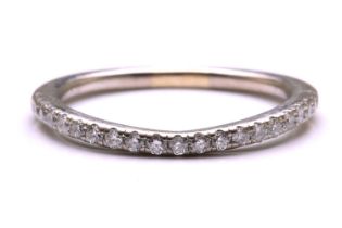 A diamond-set half eternity ring, consisting of an array of round brilliant-cut diamonds pavé-set