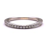 A diamond-set half eternity ring, consisting of an array of round brilliant-cut diamonds pavé-set