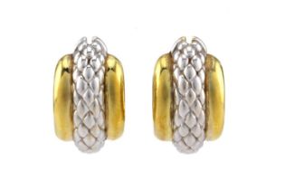 FOPE - a pair of two-toned creole earrings, each featuring a hollow hoop with a textured section