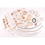 A bag of assorted base metal costume jewellery, including various Indian-style jewellery sets,