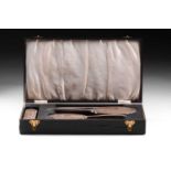 A silver mounted four-piece dressing table set in a fitted case, each with a vacant tapering