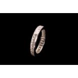 A full hoop diamond eternity ring; the platinum band set with a continuous row of channel set