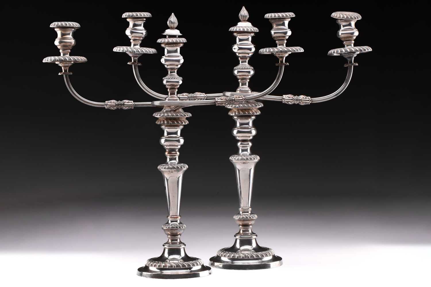A pair of large silver plated two branch candelabra, the two scroll branches with detachable