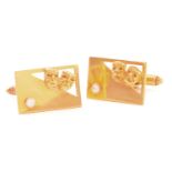 A pair of yellow metal tragedy & comedy cufflinks, each collet set with a brilliant-cut diamond