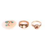 Two 9ct gold gem-set rings and a white agate panel decoration; inluding a three-stone ring with