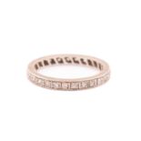A diamond eternity ring, fully pavé-set with round single-cut diamonds, each approximately