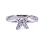 A four-stone diamond petal ring, consisting of four marquise-cut diamonds with an approximate colour