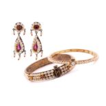 Indian gem-set jewellery including two bangles and a pair of drop earrings; The first bangle