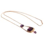 An amethyst and seed pearl lavalier necklace, featuring a large cushion-cut amethyst,