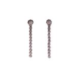 A pair of diamond line drop earrings, each has a dangling enhancing part detachable from the