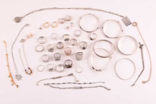 A collection of silver and white metal jewellery including a CZ cluster ring hallmarked as '925',