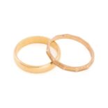 A 22ct gold wedding band and a 9ct gold ring; a plain D-section band in 22ct yellow gold, London