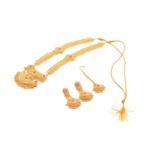 A yellow metal and ruby set bridal suite; comprising a necklace, pendant earrings, and hair piece;