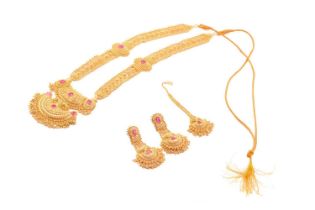 A yellow metal and ruby set bridal suite; comprising a necklace, pendant earrings, and hair piece;