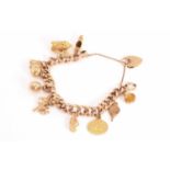 A 9ct gold charm bracelet, consisting of a hollow rose gold curb chain, attached with a collection