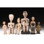 A group of six Adan/Ewe maternal figures, Ghana/Togo, all but one modelled seated, the largest