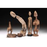 Three Dogon standing figures, Mali, comprising a stooping male figure, 56cm; a female figure with