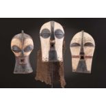 Three Songye kifwebe, Democratic Republic of Congo, each with incised linear decoration, painted