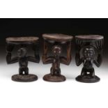 A Luba double caryatid stool, Democratic Republic of Congo, carved as a standing male and female,