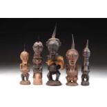 A group of five Songye power figures, Nikisi, Democratic Republic of Congo, each with animal horn