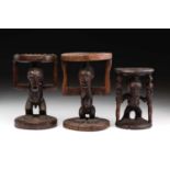 Three Songye caryatid stools, Democratic Republic of Congo, the smaller stool carved as a standing
