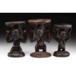 Three Luba female caryatid stools, Democratic Republic of Congo, two carved as standing, one
