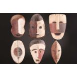 Six Bira masks, Democratic Republic of Congo, the faces painted in black, red & white pigments,