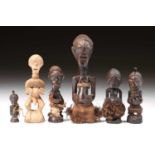 A group of Songye power figures, Nikisi, and a pendant, Democratic Republic of Congo, each figure