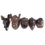 A collection of zoomorphic masks, to include three Baule monkey masks, Ivory Coast, painted in
