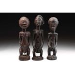 Two Tabwa standing female figures and a male figure, Democratic Republic of Congo, each with