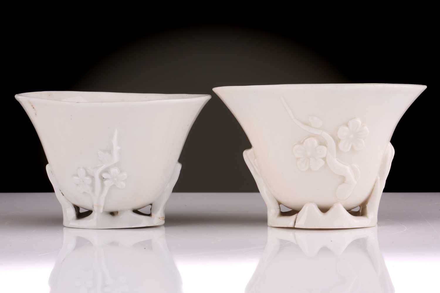 Two Chinese Dehua blanc de chine libation cups, Qing dynasty, 18th century, each with applied - Image 2 of 35