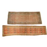 An antique brick red ground Malayer runner with an all-over scheme of repeating flower heads