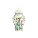 A Chinese porcelain vase and cover, of meiping form, painted with birds flying amongst peony and