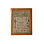 A Victorian woolwork alphabetical sampler with moral verse and stylized shrubs birds geometric