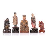 A Chinese carved wood and lacquered seated Emperor, Ming/Qing, wearing a relief moulded dragon robe,