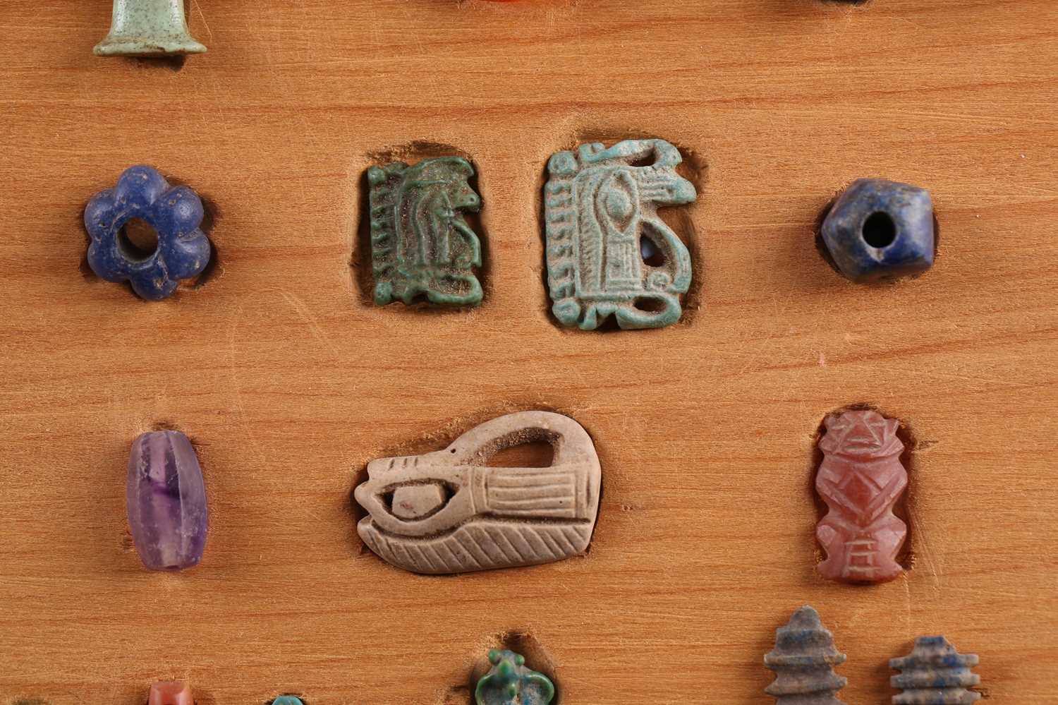 A Collection of Ancient Egyptian artefacts including a bronze Djed pillar amulet, agate Tawaret - Image 3 of 30