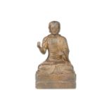 A Chinese Sino Tibetan style bronze figure of Bodhidharma, seated in dhyanasana, in loose robes on a