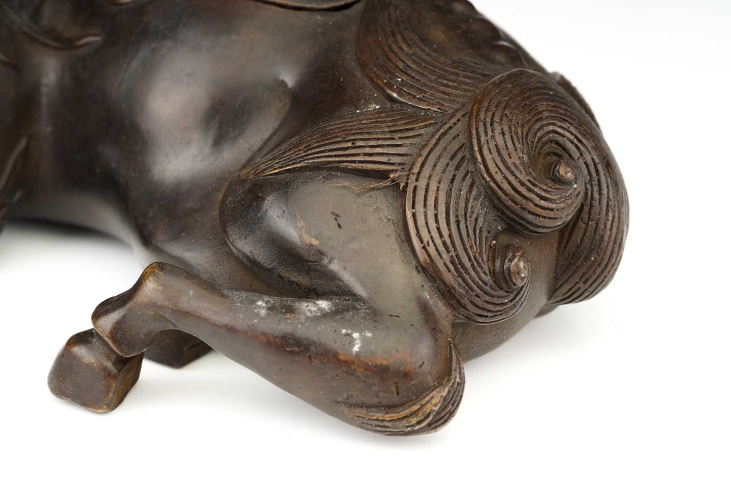 A Chinese bronze figure of a recumbent Pixiu, its snarling head turned over its shoulder, the lid - Image 3 of 7