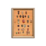 A Collection of Ancient Egyptian artefacts including a bronze Djed pillar amulet, agate Tawaret