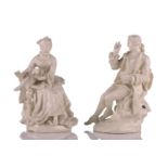 An 18th-century Derby "Blanc de Chine figure of a lady seated with a parrot, on a circular base 17
