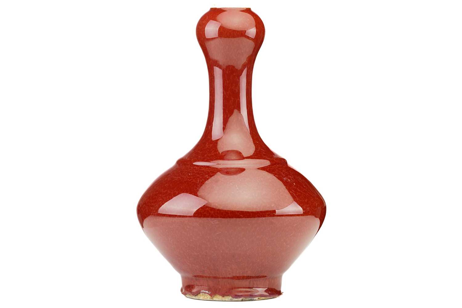 A Chinese sang de boeuf glazed vase, Suantouping, with garlic shaped mouth above a compressed