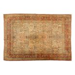 A large ivory ground "Tree of Life" antique Kirman" carpet, the field filled with intricate