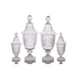 A pair of 19th century Anglo Irish cut glass urns and covers with oval knop finials, domed covers