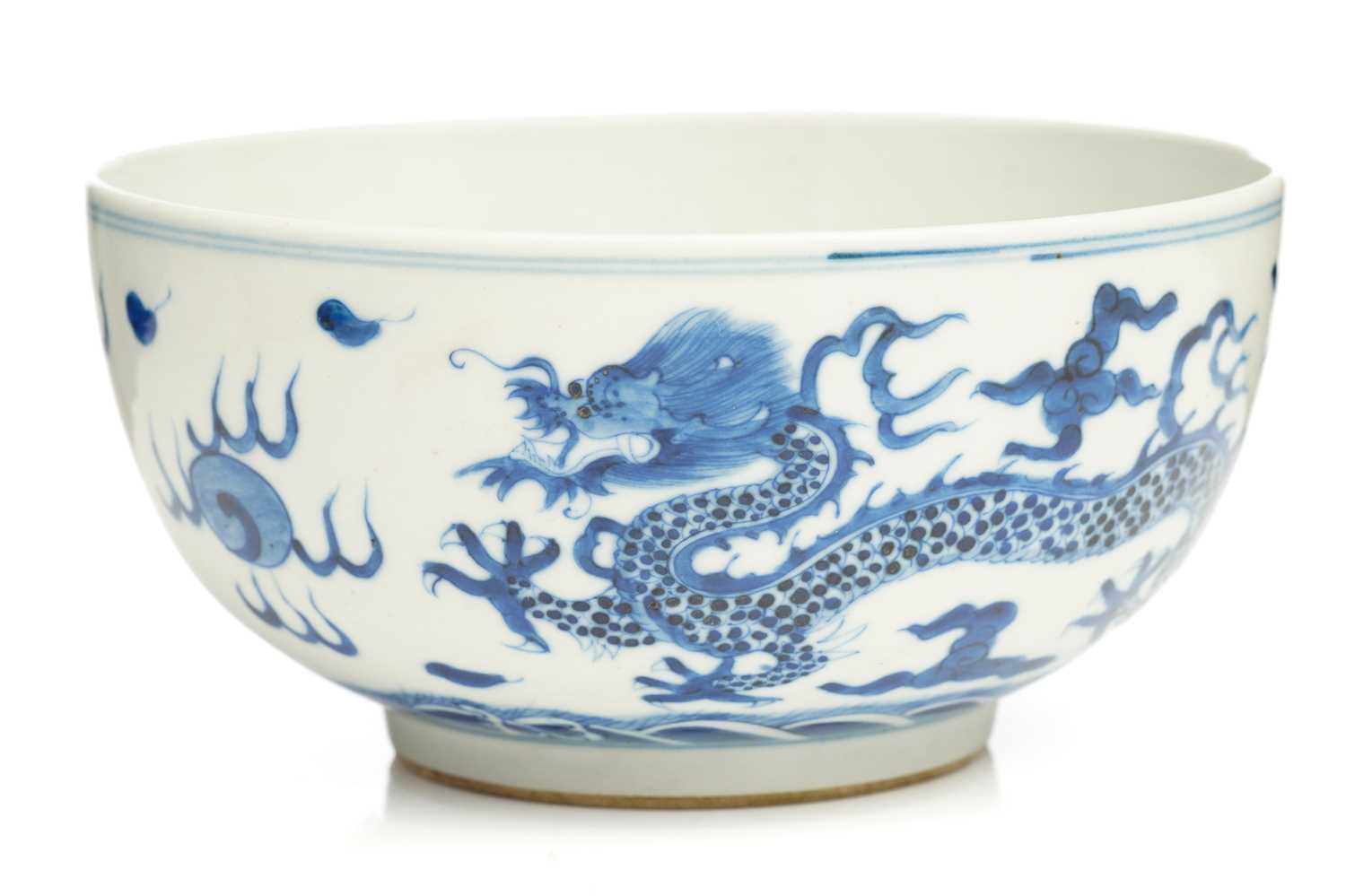 A Chinese porcelain blue & white dragon bowl, the interior with a single writhing dragon, the
