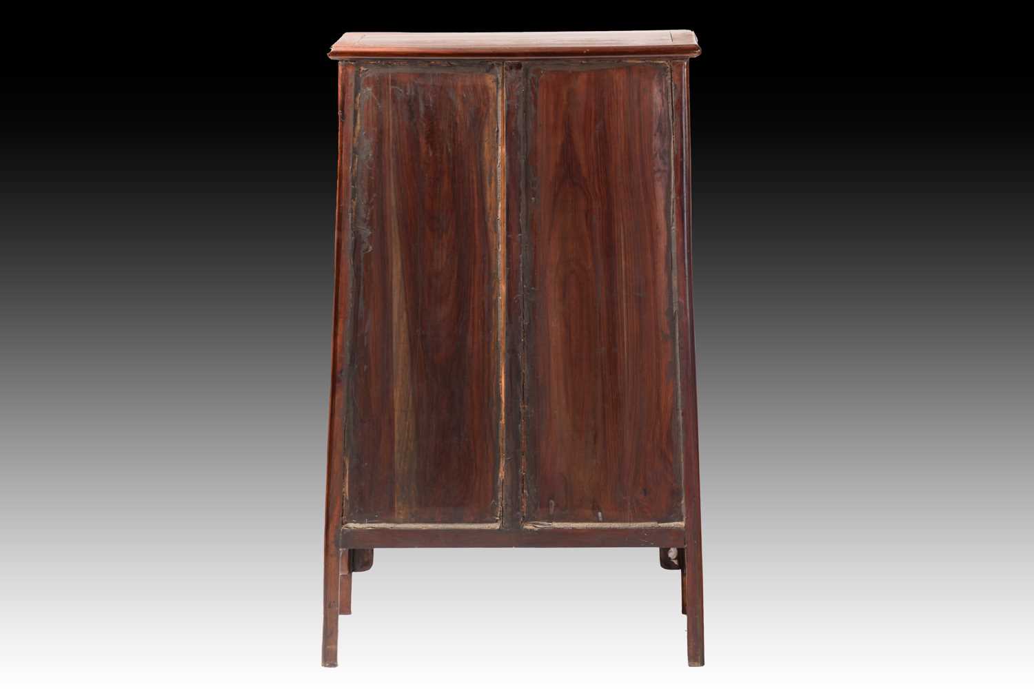 A Chinese Huanghuali tapering two-door cabinet with radiused corners, Qing Dynasty. Each door with - Image 5 of 50