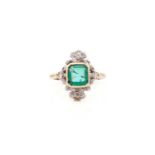 An emerald and diamond panel ring, featuring a square emerald-cut stone approximately measures 7.6 x